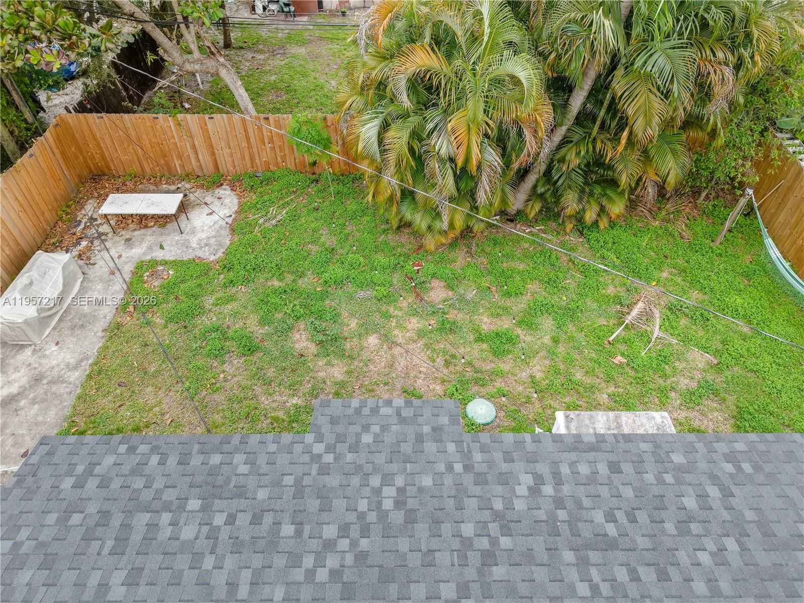 491 Northwest 108th Terrace Miami, FL 33168 - Photo 32 of 37 a backyard of a house with table and chairs