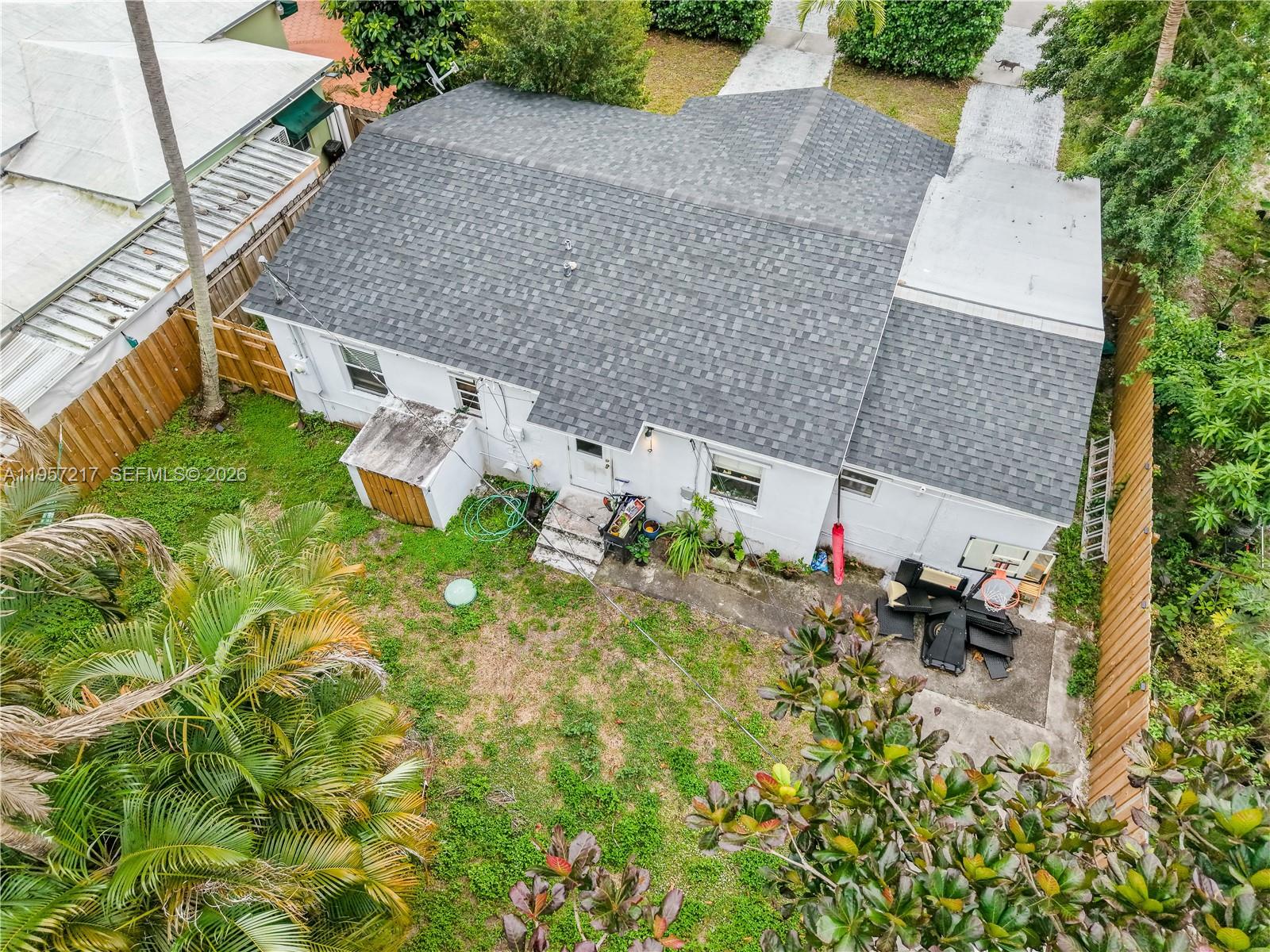 491 Northwest 108th Terrace Miami, FL 33168 - Photo 33 of 37 an aerial view of a house with a yard and sitting area