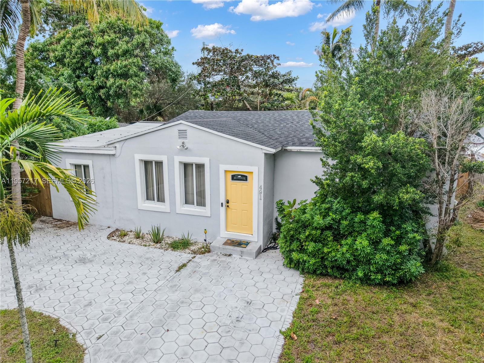 491 Northwest 108th Terrace Miami, FL 33168 - Photo 37 of 37 a front view of a house with garden