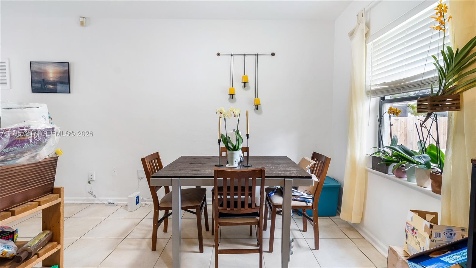 491 Northwest 108th Terrace Miami, FL 33168 - Photo 10 of 37 a view of a dining room with furniture window and wooden floor