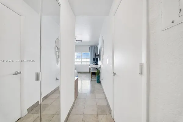 a view of a hallway with a wooden shelves