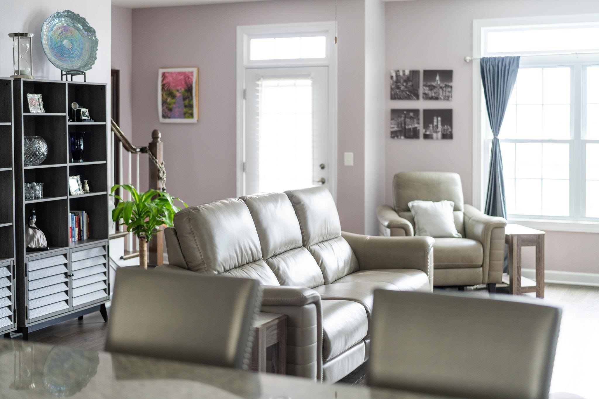 1644 Delphi Drive Charlottesville, VA 22911 - Photo 20 of 39 a living room with furniture a bookshelf and a window