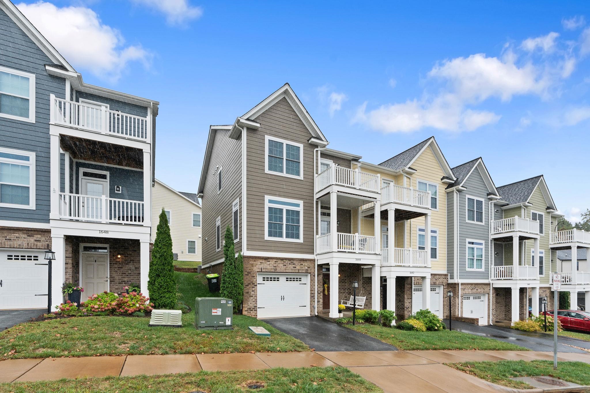 1644 Delphi Drive Charlottesville, VA 22911 - Photo 2 of 39 a front view of residential houses with yard and green space