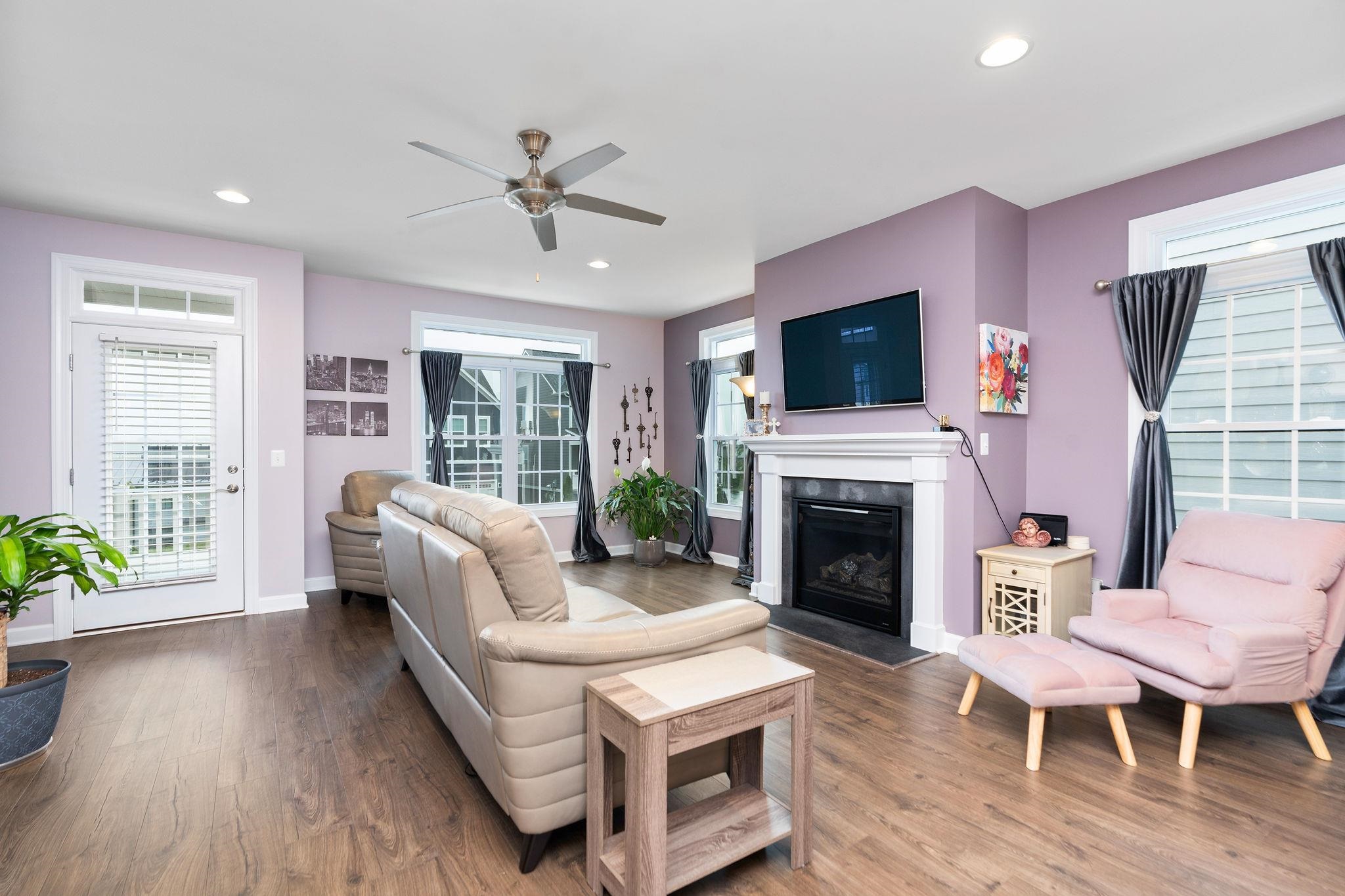 1644 Delphi Drive Charlottesville, VA 22911 - Photo 21 of 39 a living room with furniture a fireplace and a flat screen tv