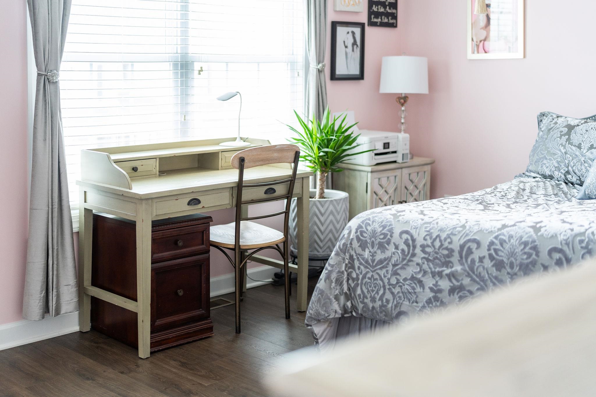 1644 Delphi Drive Charlottesville, VA 22911 - Photo 28 of 39 a bedroom with a bed and a potted plant on the dresser