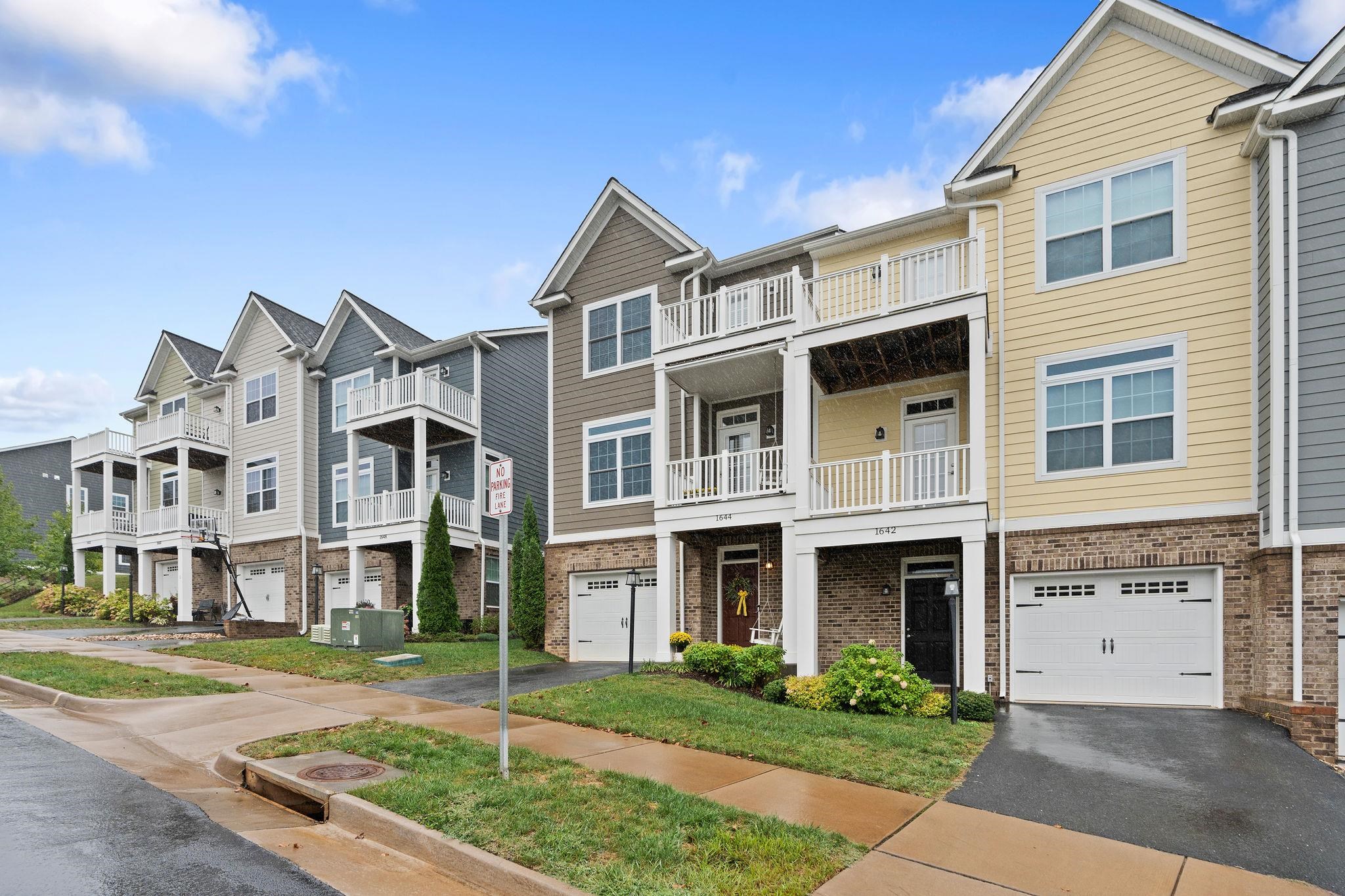 1644 Delphi Drive Charlottesville, VA 22911 - Photo 3 of 39 a front view of residential houses with yard