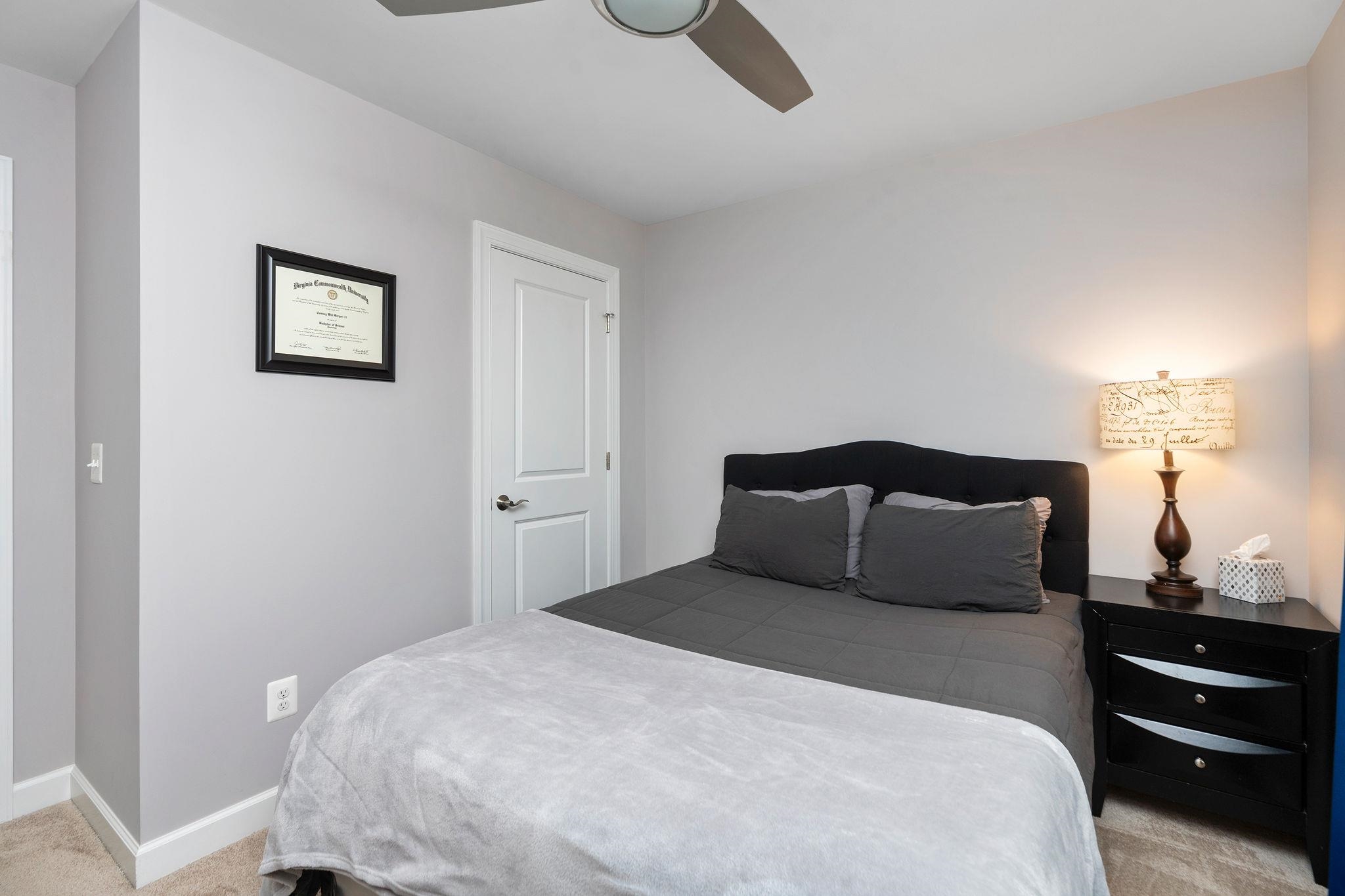 1644 Delphi Drive Charlottesville, VA 22911 - Photo 32 of 39 a bedroom with a bed and cabinets