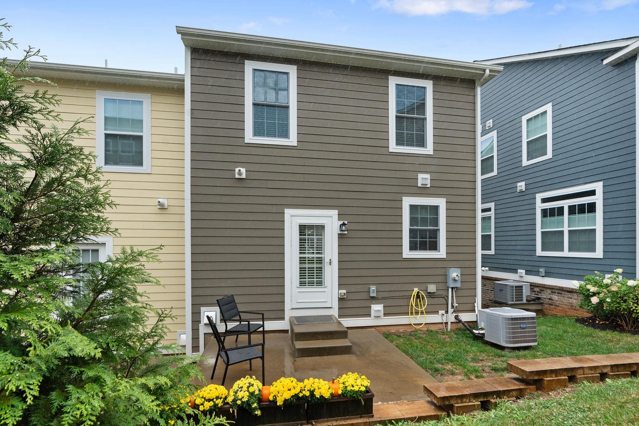 1644 Delphi Drive Charlottesville, VA 22911 - Photo 36 of 39 a front view of a house with a yard and a garden