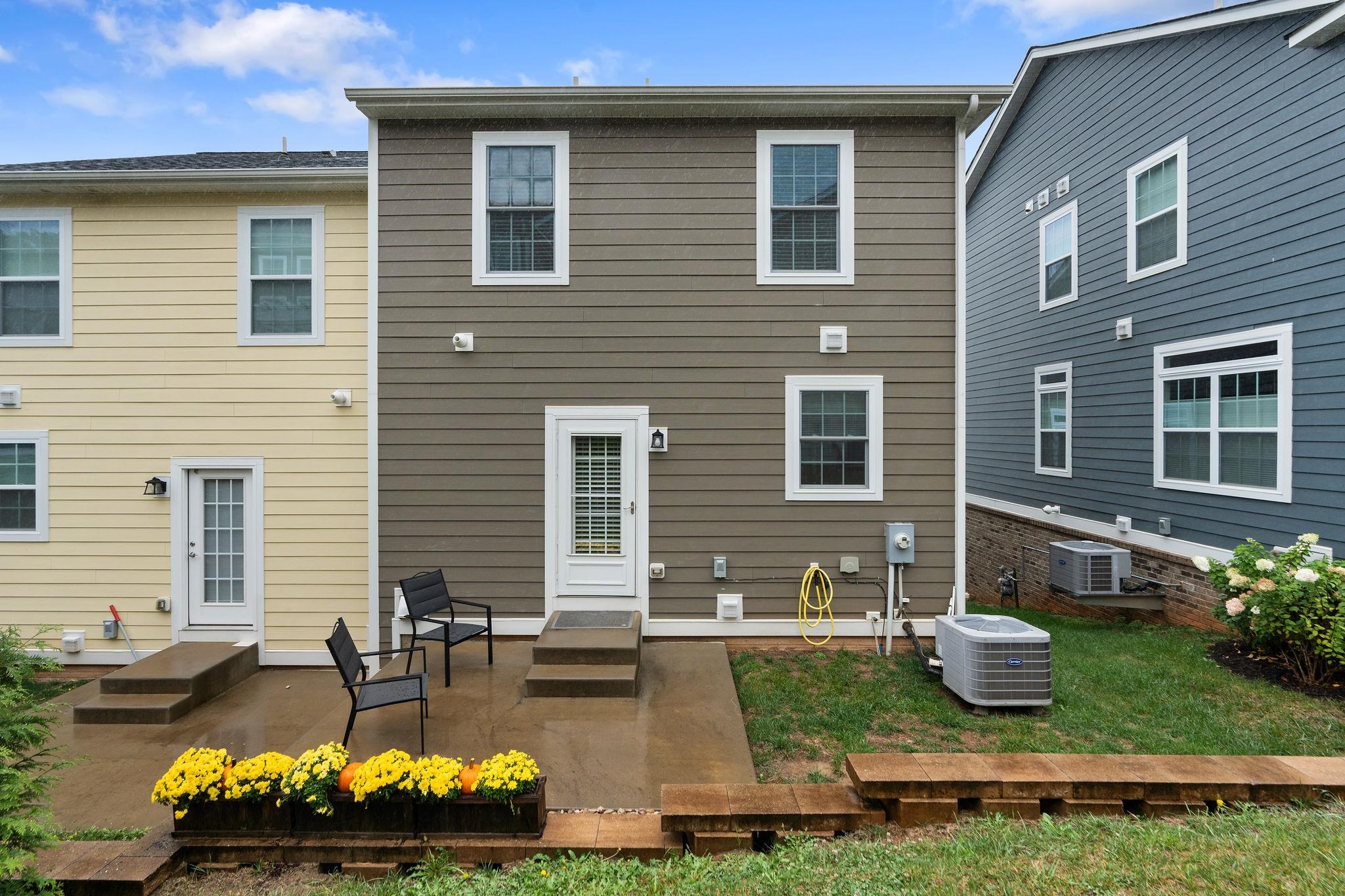 1644 Delphi Drive Charlottesville, VA 22911 - Photo 38 of 39 a front view of a house with garden and chairs