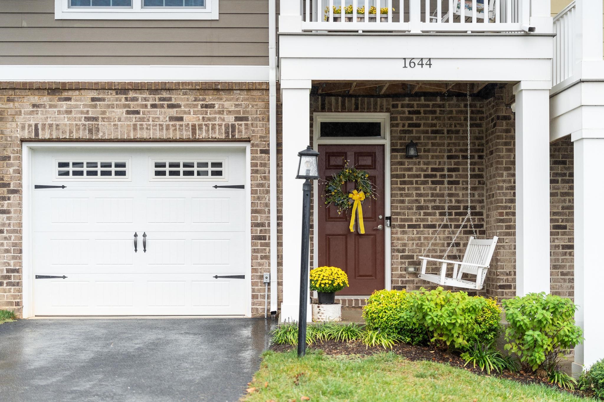 1644 Delphi Drive Charlottesville, VA 22911 - Photo 6 of 39 a front view of a building with a garden