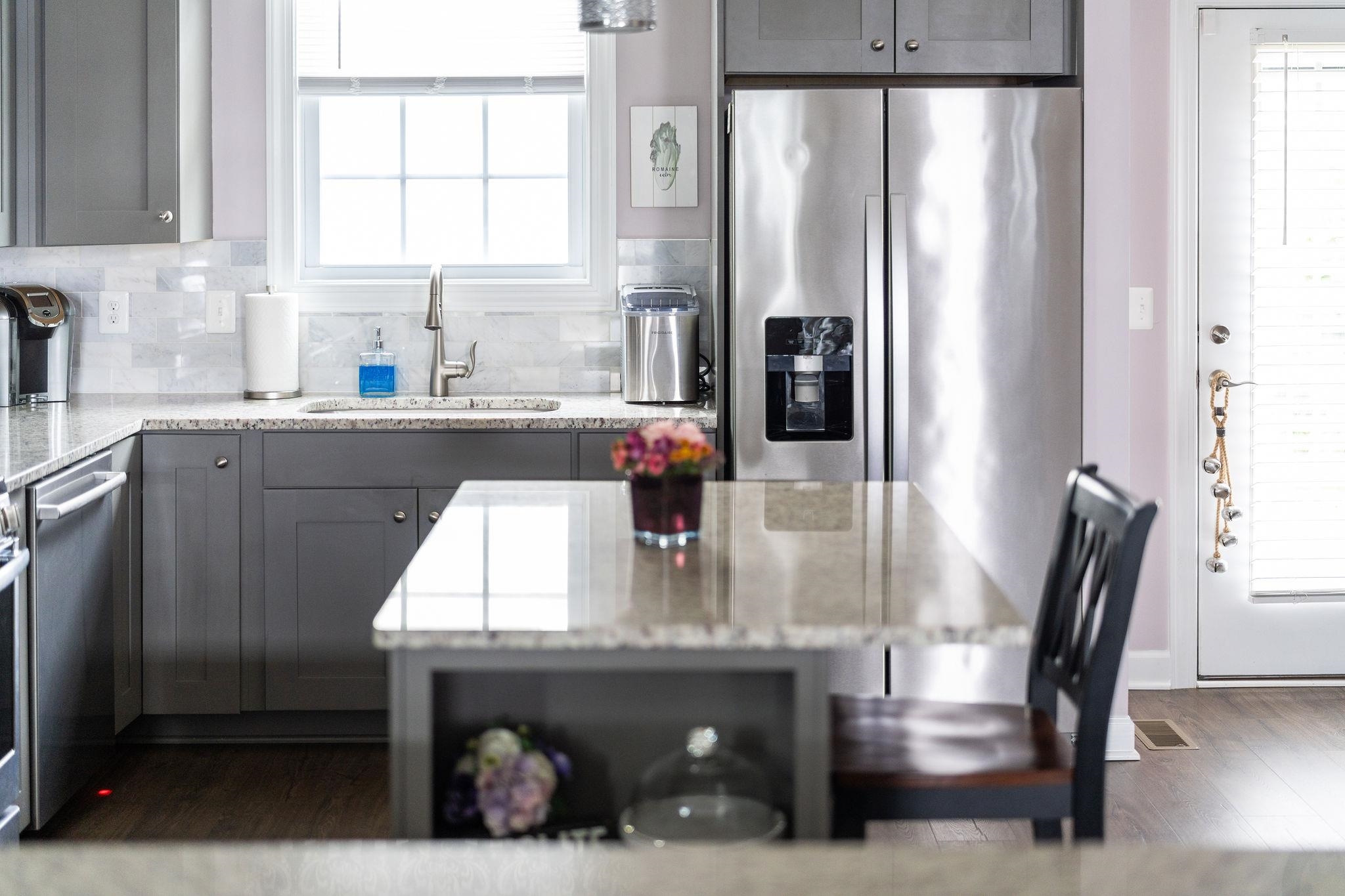1644 Delphi Drive Charlottesville, VA 22911 - Photo 9 of 39 a kitchen with a table chairs and a window