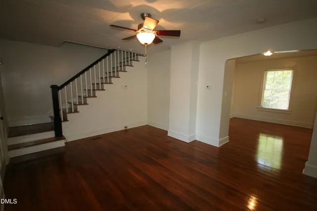 a bathroom with a toilet bathtub window and shower