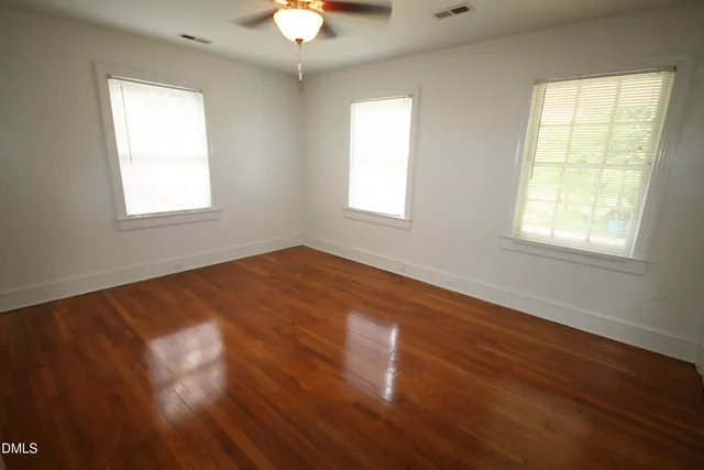 a kitchen with a refrigerator and a stove