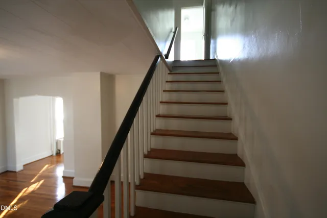 a kitchen that has a sink a stove and window