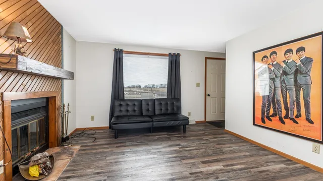 a view of a livingroom with furniture and a fireplace