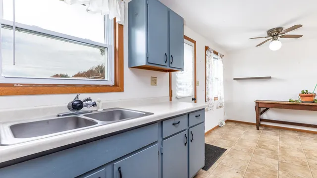a kitchen with a sink and a window