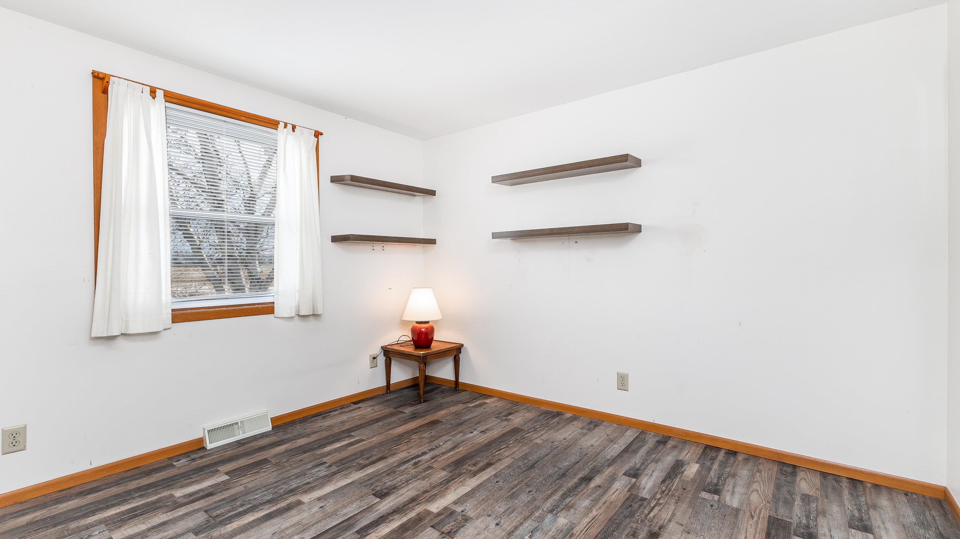 10-a125 E Apple Canyon Road Apple River, IL 61001 - Photo 9 of 29 a view of empty room with wooden floor and fan