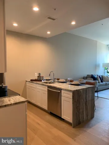 a kitchen with a stove and a sink