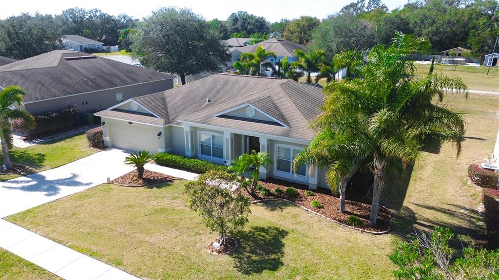 2845 Eagle Nest View Drive Winter Haven, FL 33881 - Photo 1 of 1 a aerial view of a house with swimming pool and garden