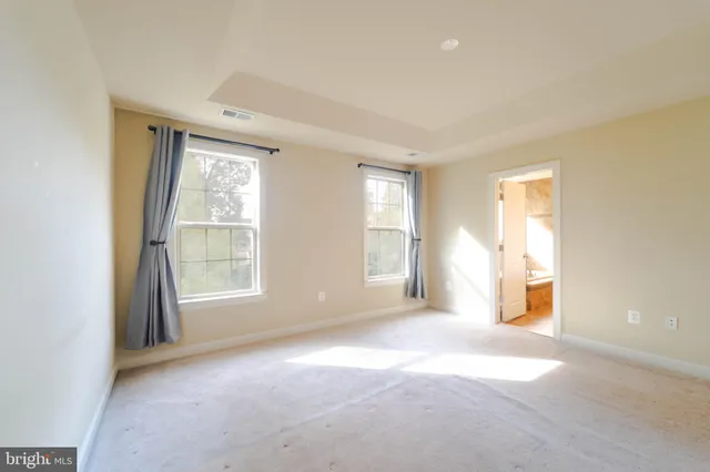 a bathroom with a granite countertop bathtub shower sink and mirror