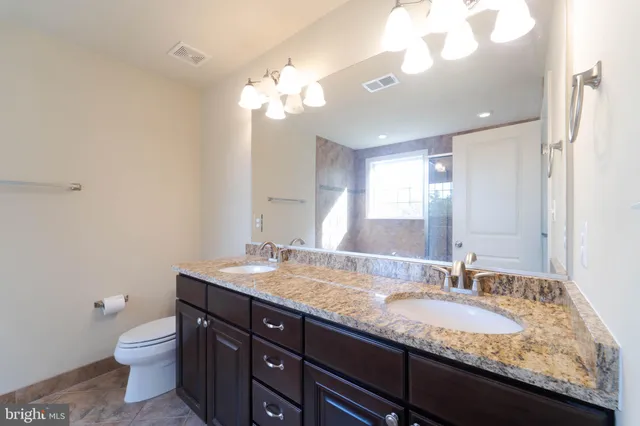 a bathroom with a glass shower door