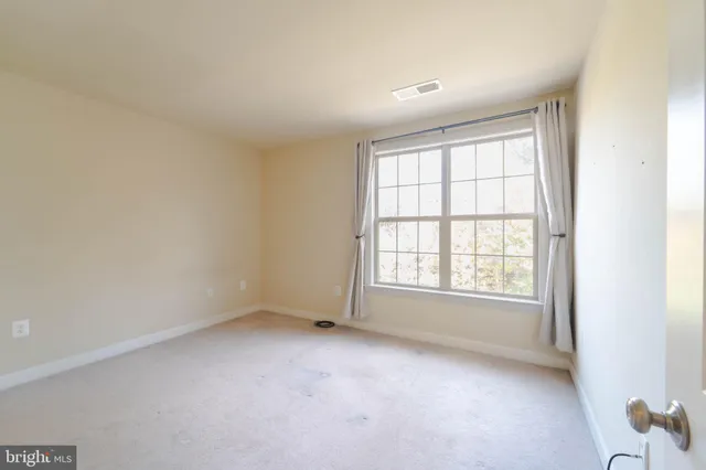 a view of a house with a large window