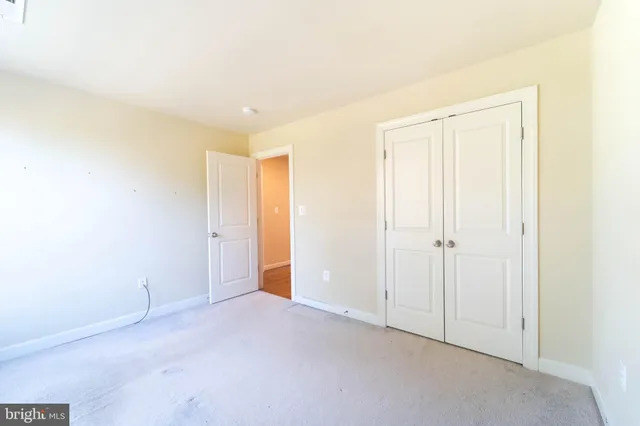 a view of a house with a wooden deck