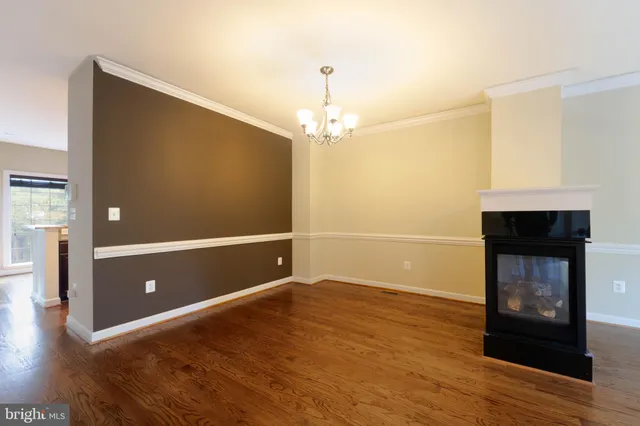 a view of livingroom with hardwood floor and fireplace