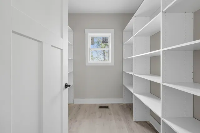 a view of an empty walk in closet