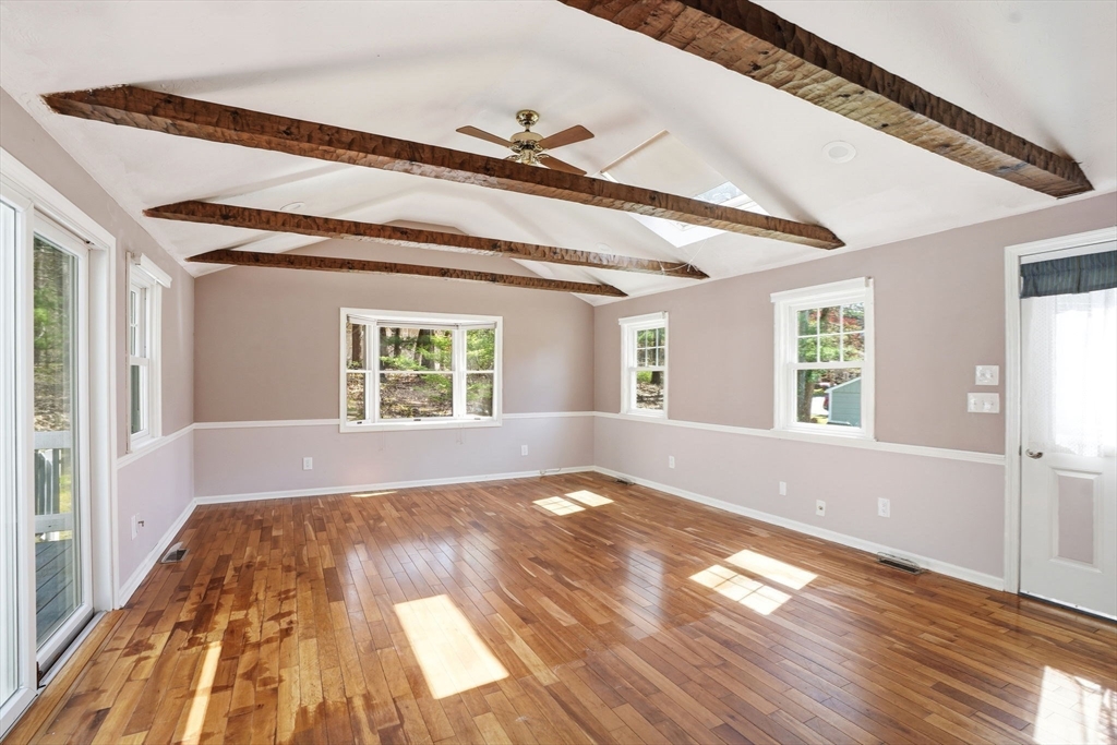 3 Fairway Drive Canton, MA 02021 - Photo 7 of 34 a view of an empty room with wooden floor and a window