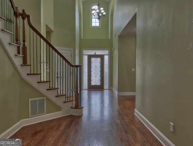 a view of gallery with wooden floor