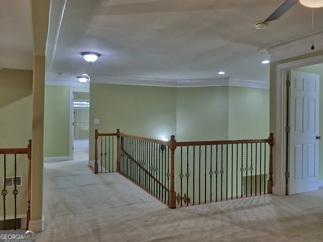 an empty room with a empty space and windows