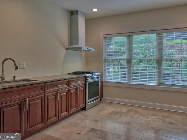 a kitchen with a sink and a stove