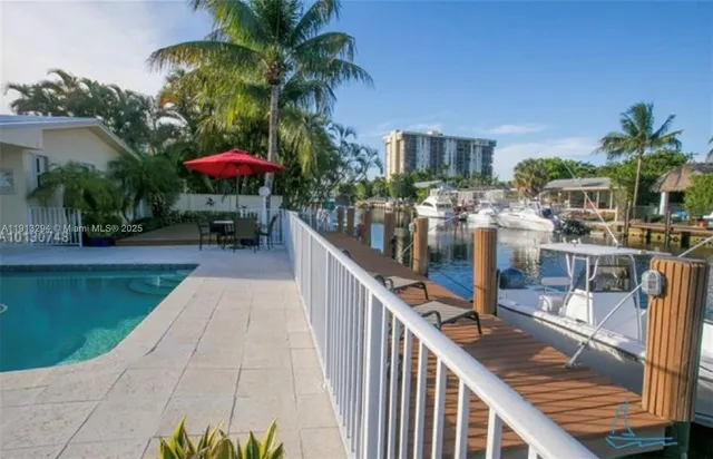 a view of a patio with swimming pool