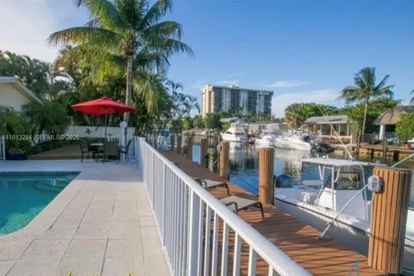 a view of a swimming pool with a patio