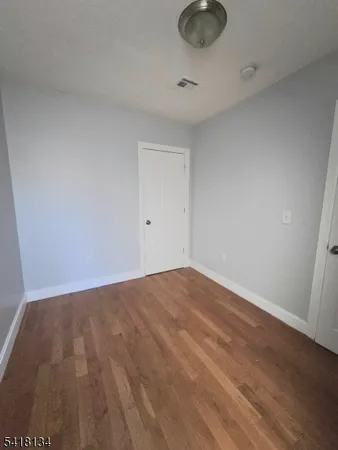 a kitchen with granite countertop a stove and a microwave