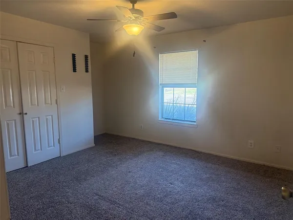 a living room with furniture and a dining table