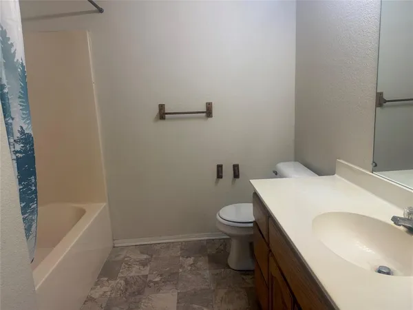 a bathroom with sink and mirror