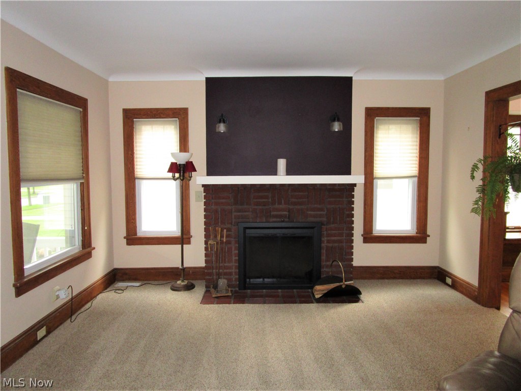 5131 Eastover Road Cleveland, OH 44124 - Photo 8 of 21 Brick fierplace with sconces.
