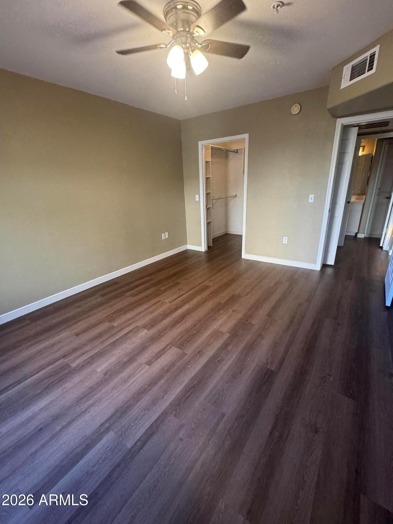 1295 North Ash Street, Unit 612 Gilbert, AZ 85233 - Photo 7 of 10 wooden floor in an empty room with a window
