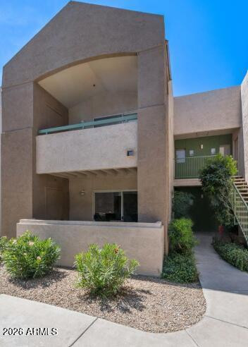 1295 North Ash Street, Unit 612 Gilbert, AZ 85233 - Photo 9 of 10 a front view of a house with garden