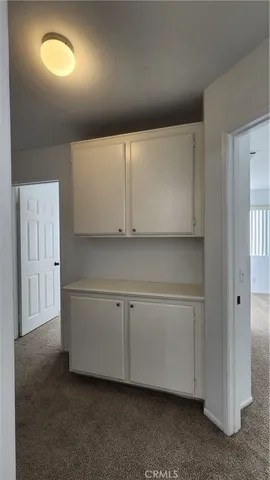 a bathroom with double vanity and a mirror