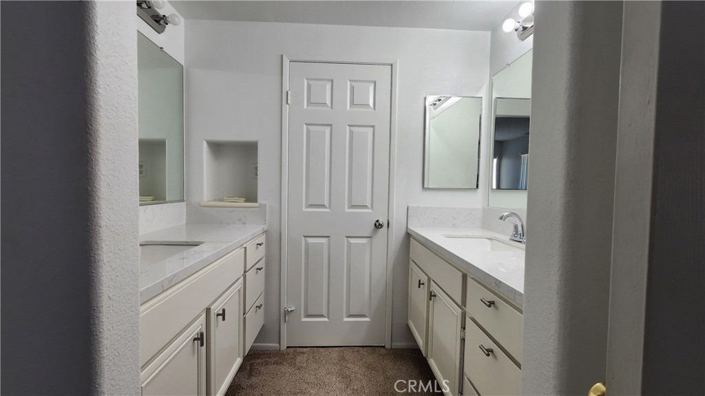 1496 Dusty Hill Road Hemet, CA 92545 - Photo 15 of 31 a bathroom with a granite countertop sink and a mirror