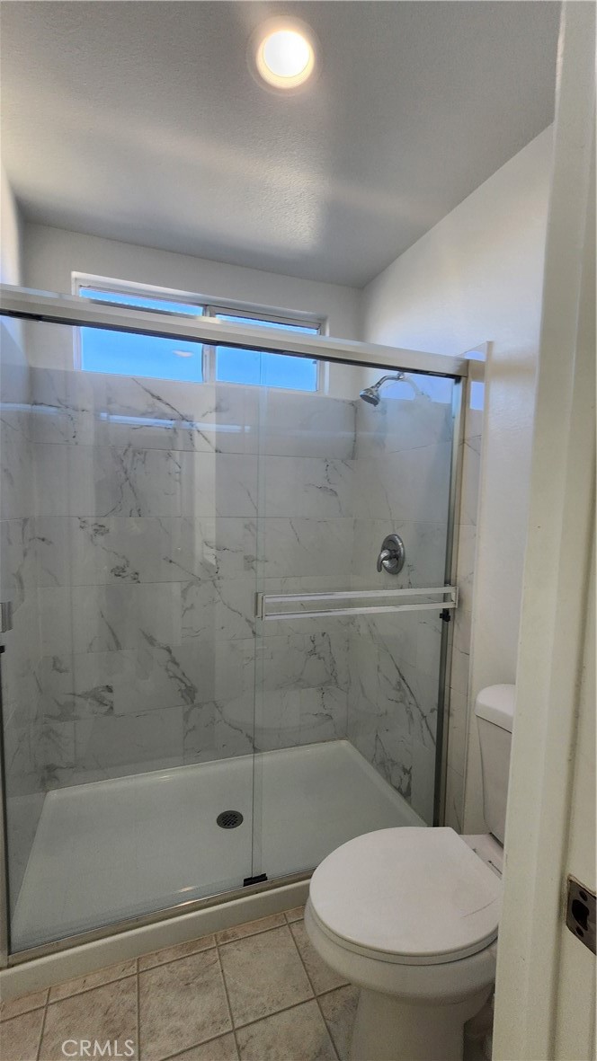 1496 Dusty Hill Road Hemet, CA 92545 - Photo 17 of 31 a bathroom with a shower and a toilet