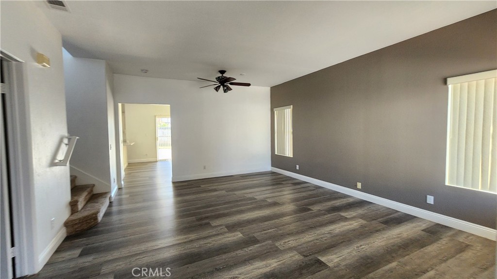 1496 Dusty Hill Road Hemet, CA 92545 - Photo 23 of 31 a view of empty room with wooden floor and fan