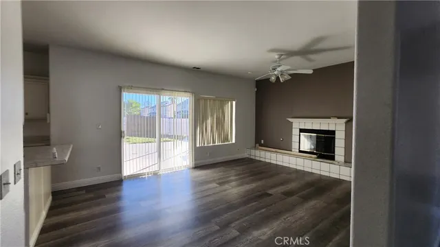 a kitchen with granite countertop a sink stove and refrigerator