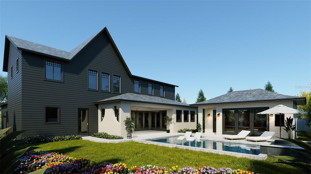 4013 West Inman Avenue Tampa, FL 33609 - Photo 5 of 8 a front view of a house with a yard table and chairs