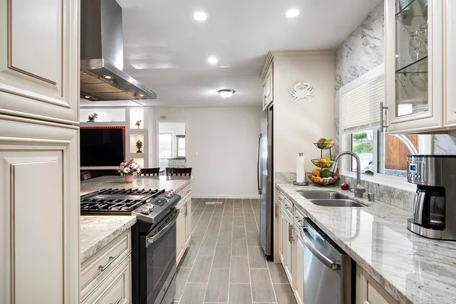 a kitchen with stove and a table