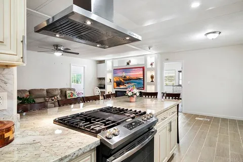 a bedroom with a large bed and a large window