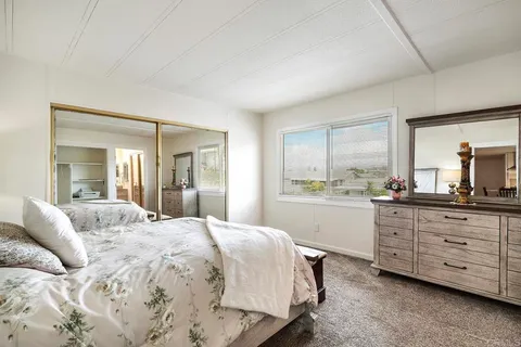 a bedroom with a bed and a walk in closet